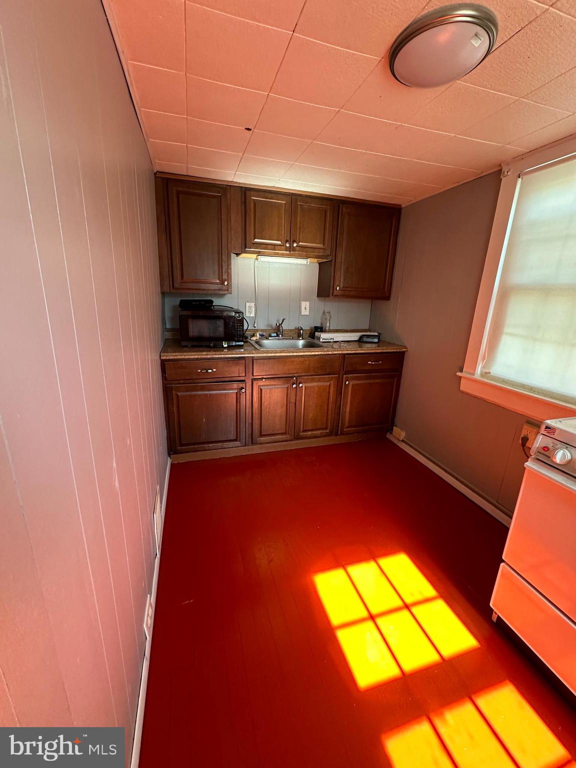 2 West Broadway Bel Air, MD 21014 - Photo 4 of 7 a kitchen with stainless steel appliances granite countertop a stove a sink and a microwave