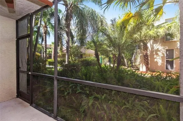 a view of a balcony with trees