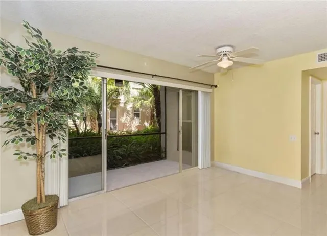 a view of a room that has a tree in it