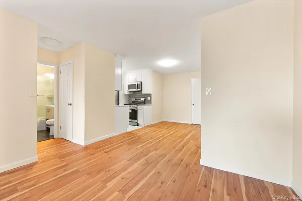 a view of kitchen and wooden floor