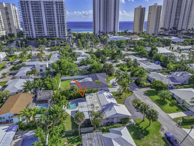 a view of a house with a yard and entertaining space