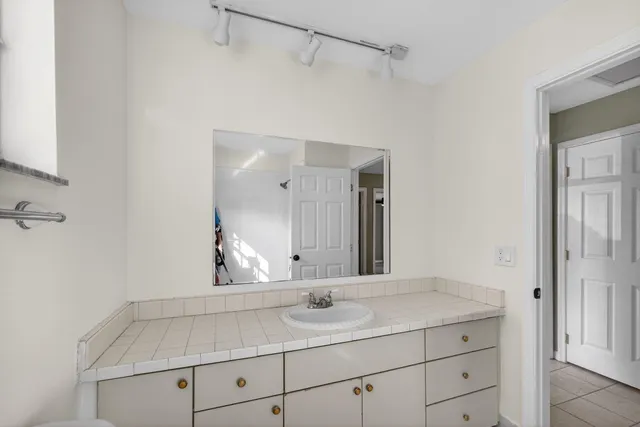 a bathroom with a shower and a toilet