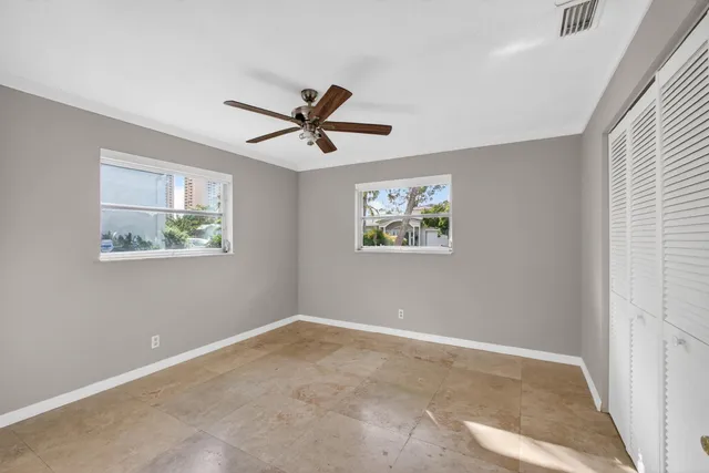 a bathroom with a sink double vanity and a toilet
