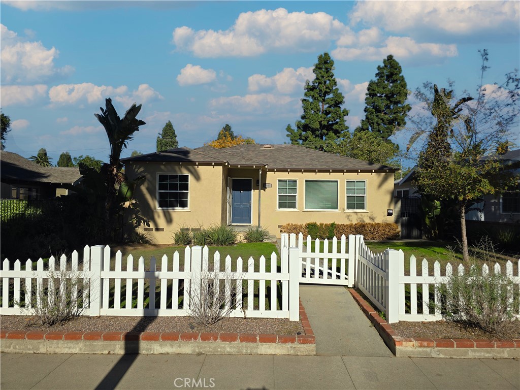 3869 Bandini Avenue Riverside, CA 92506 - Photo 17 of 17 a view of a house with wooden fence