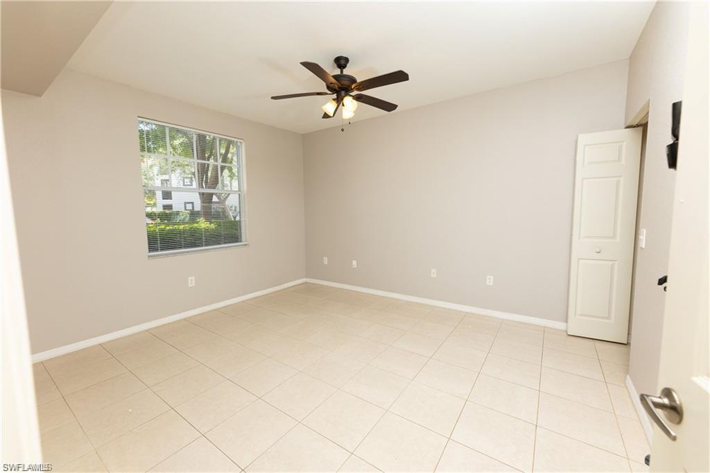 7975 Preserve Circle, Unit 1013 Naples, FL 34119 - Photo 13 of 16 a view of an empty room with a window