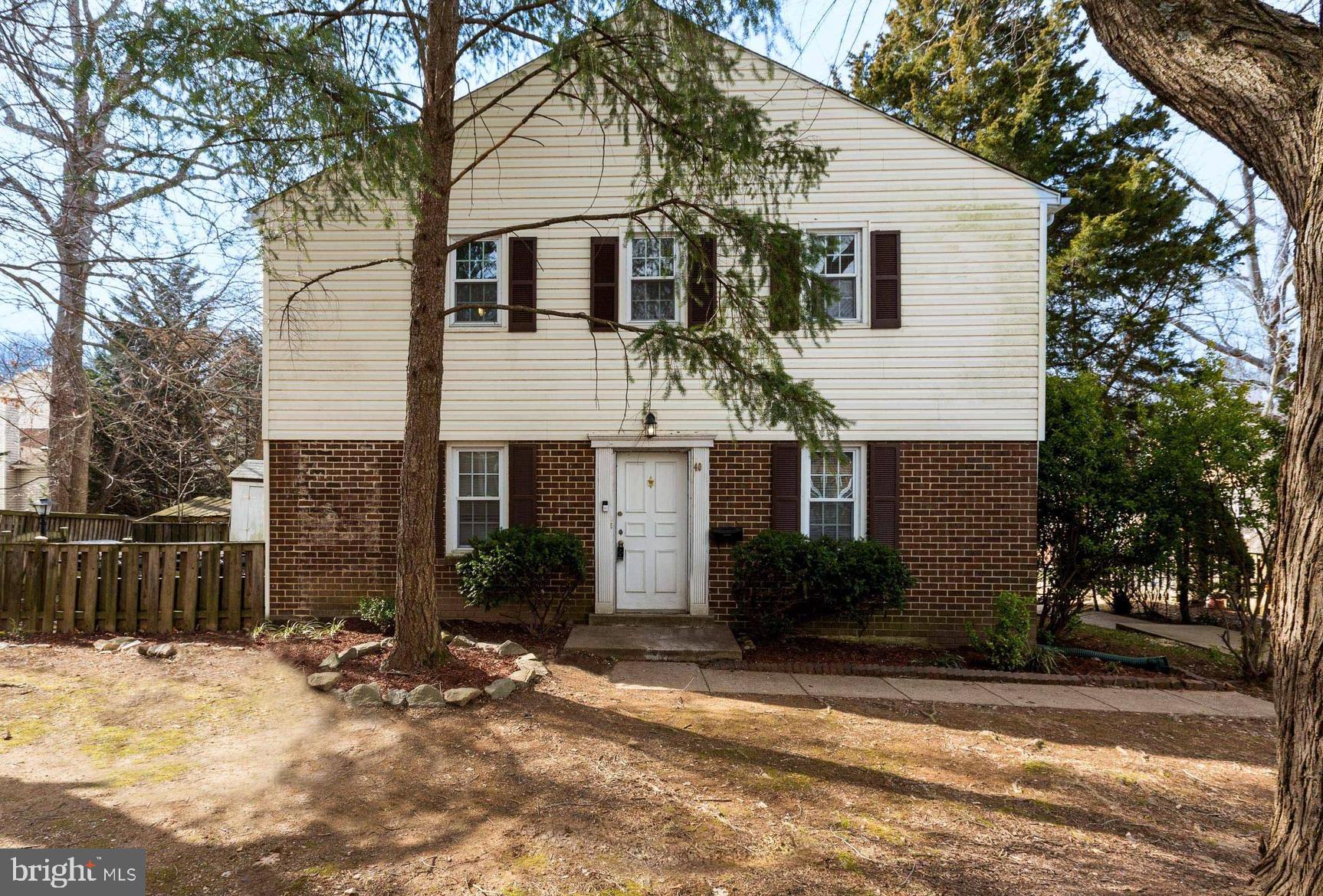 40 Hibiscus Court, Unit 1410 Gaithersburg, MD 20878 - Photo 1 of 38 a view of a house with a yard covered in snow