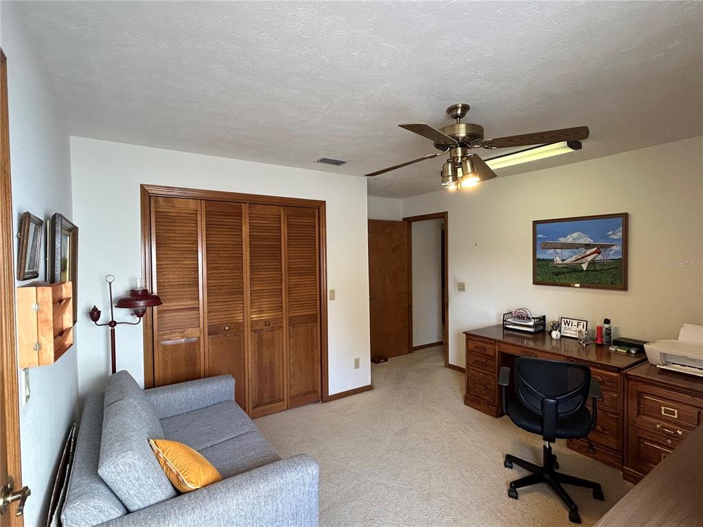 9528 Southeast 70th Terrace Ocala, FL 34472 - Photo 20 of 43 a living room with furniture and a window