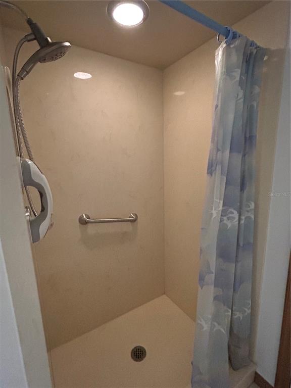 9528 Southeast 70th Terrace Ocala, FL 34472 - Photo 22 of 43 a bathroom with a shower and a mirror