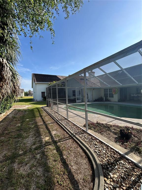 9528 Southeast 70th Terrace Ocala, FL 34472 - Photo 26 of 43 a view of a house with a yard
