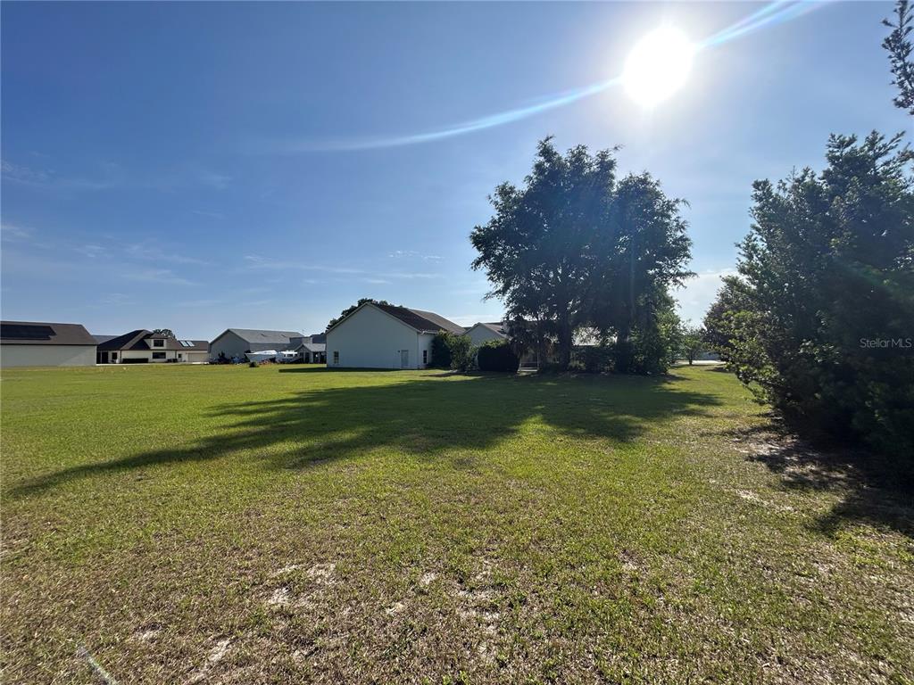 9528 Southeast 70th Terrace Ocala, FL 34472 - Photo 28 of 43 a view of a golf course with a yard