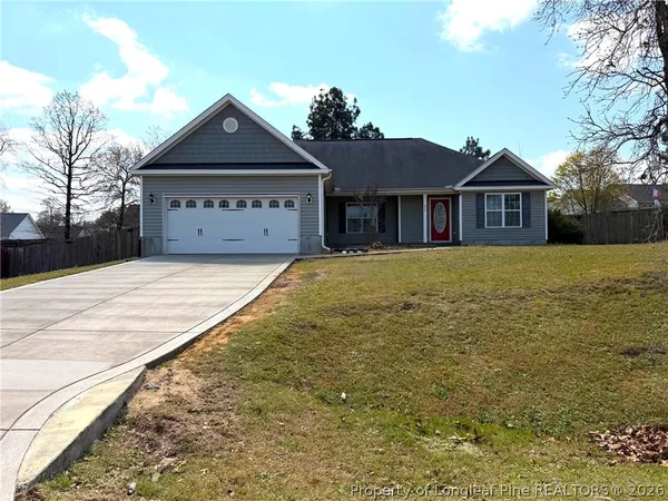 a front view of a house with yard