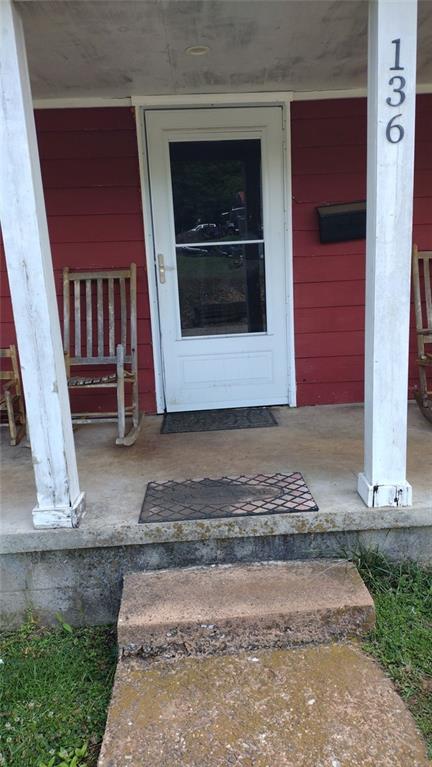 136 Hill Street Commerce, GA 30529 - Photo 6 of 27 a view of a entryway door of the house