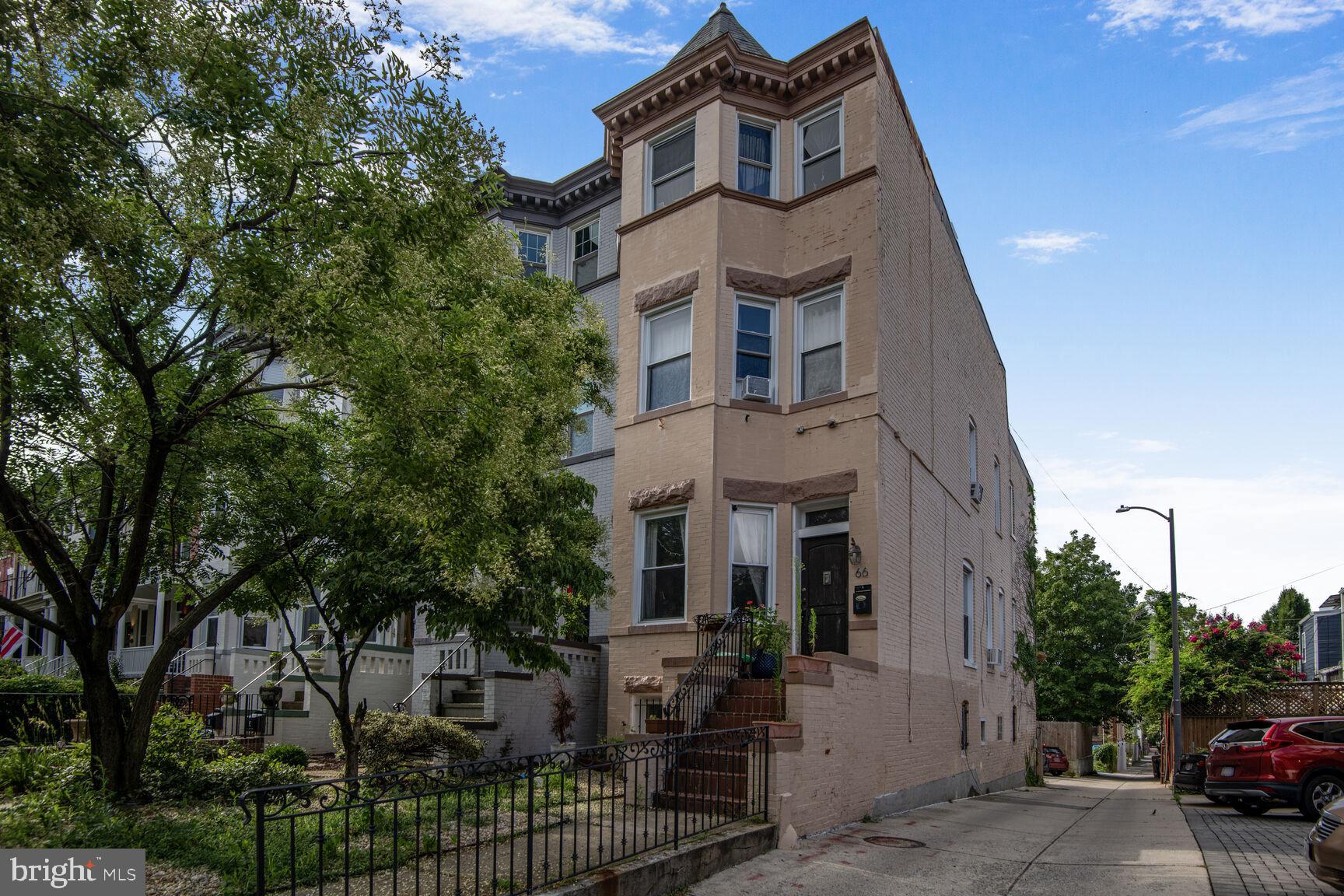66 Bryant Street Northwest, Unit B Washington, DC 20001 - Photo 1 of 17 a view of a brick building with large windows