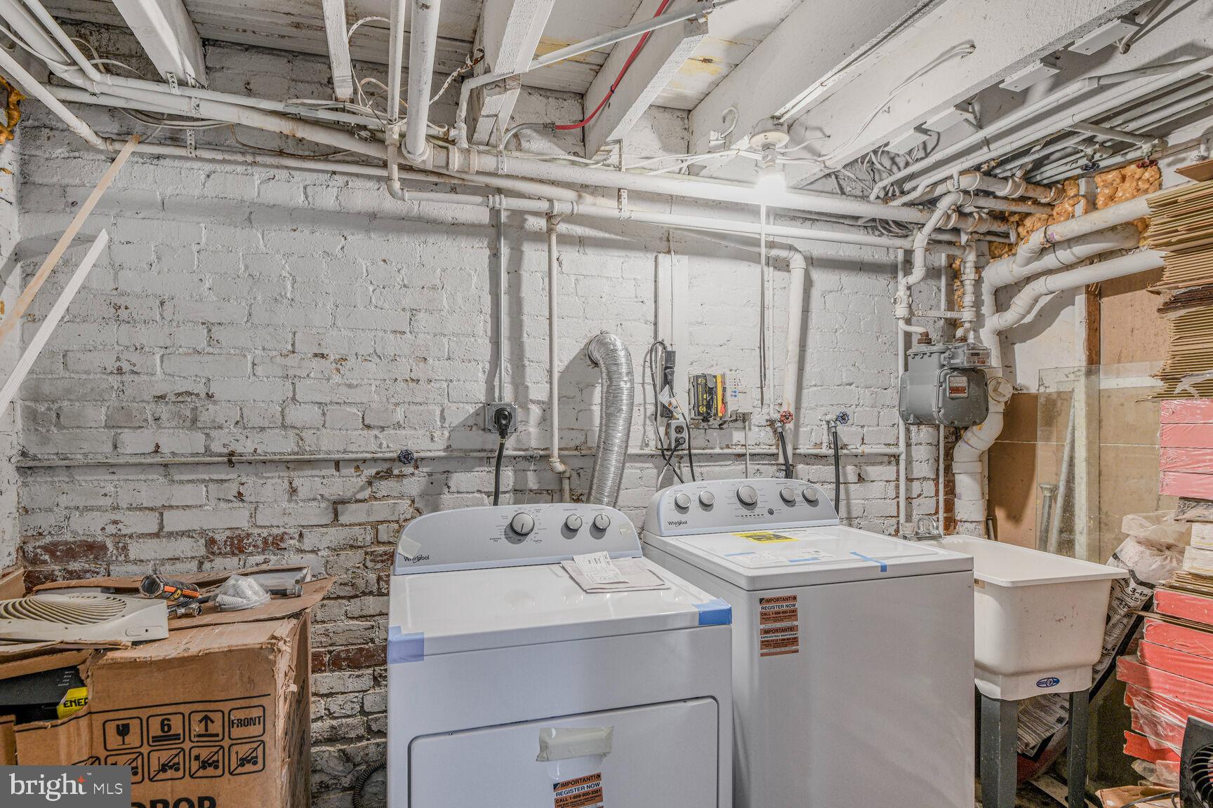 66 Bryant Street Northwest, Unit B Washington, DC 20001 - Photo 13 of 17 a utility room with dryer and washer