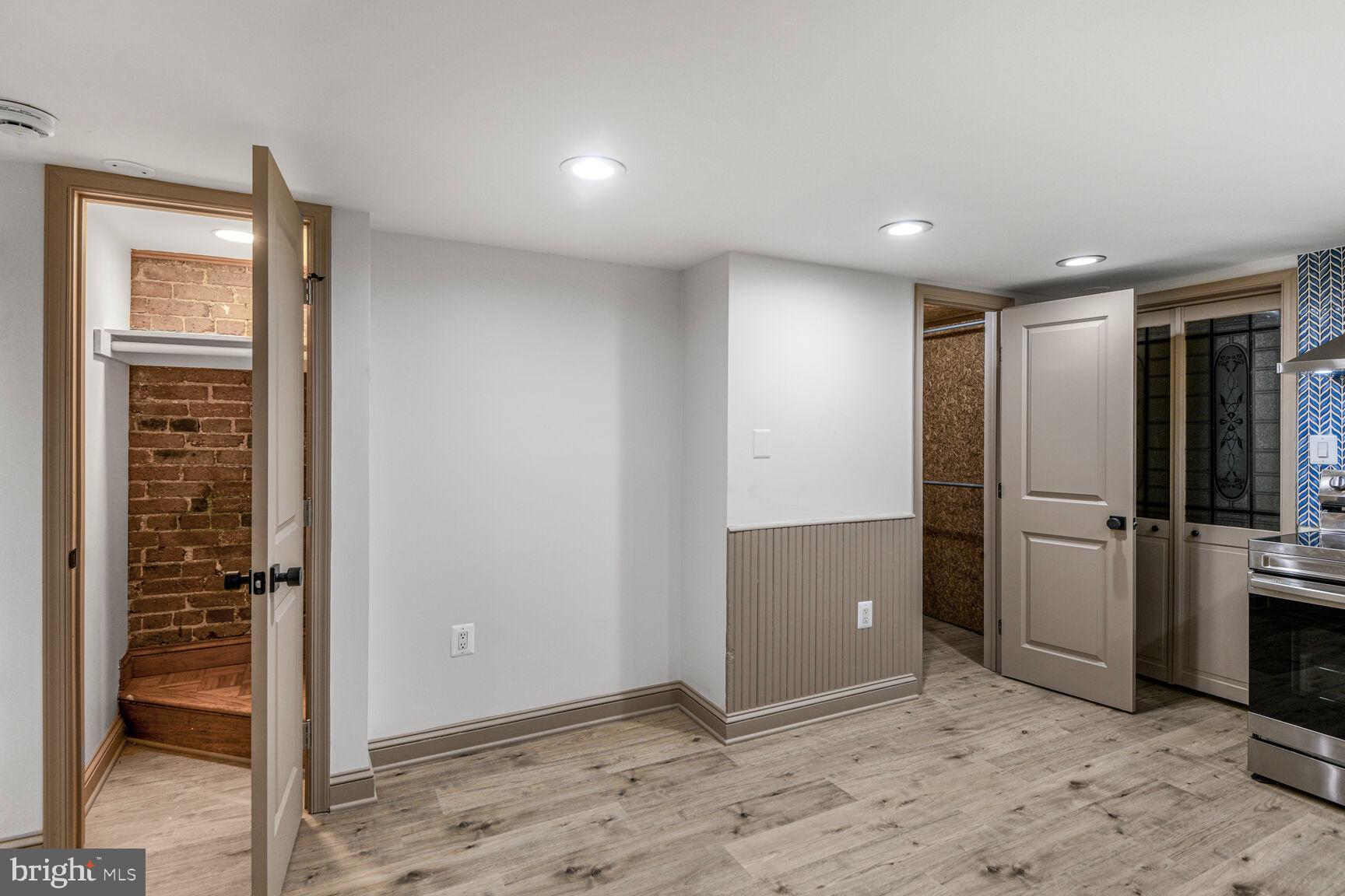 66 Bryant Street Northwest, Unit B Washington, DC 20001 - Photo 9 of 17 an empty room with closet and wooden floor