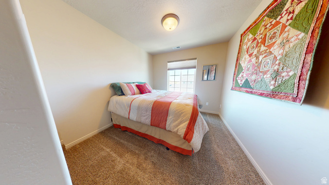 1674 Eastridge Road Price, UT 84501 - Photo 25 of 34 Carpeted bedroom featuring neutral walls and a ceiling-mounted light fixture