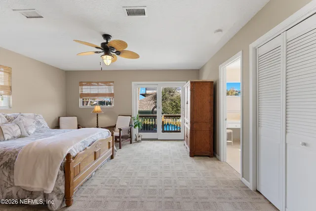 a bed room with a bed and a chandelier