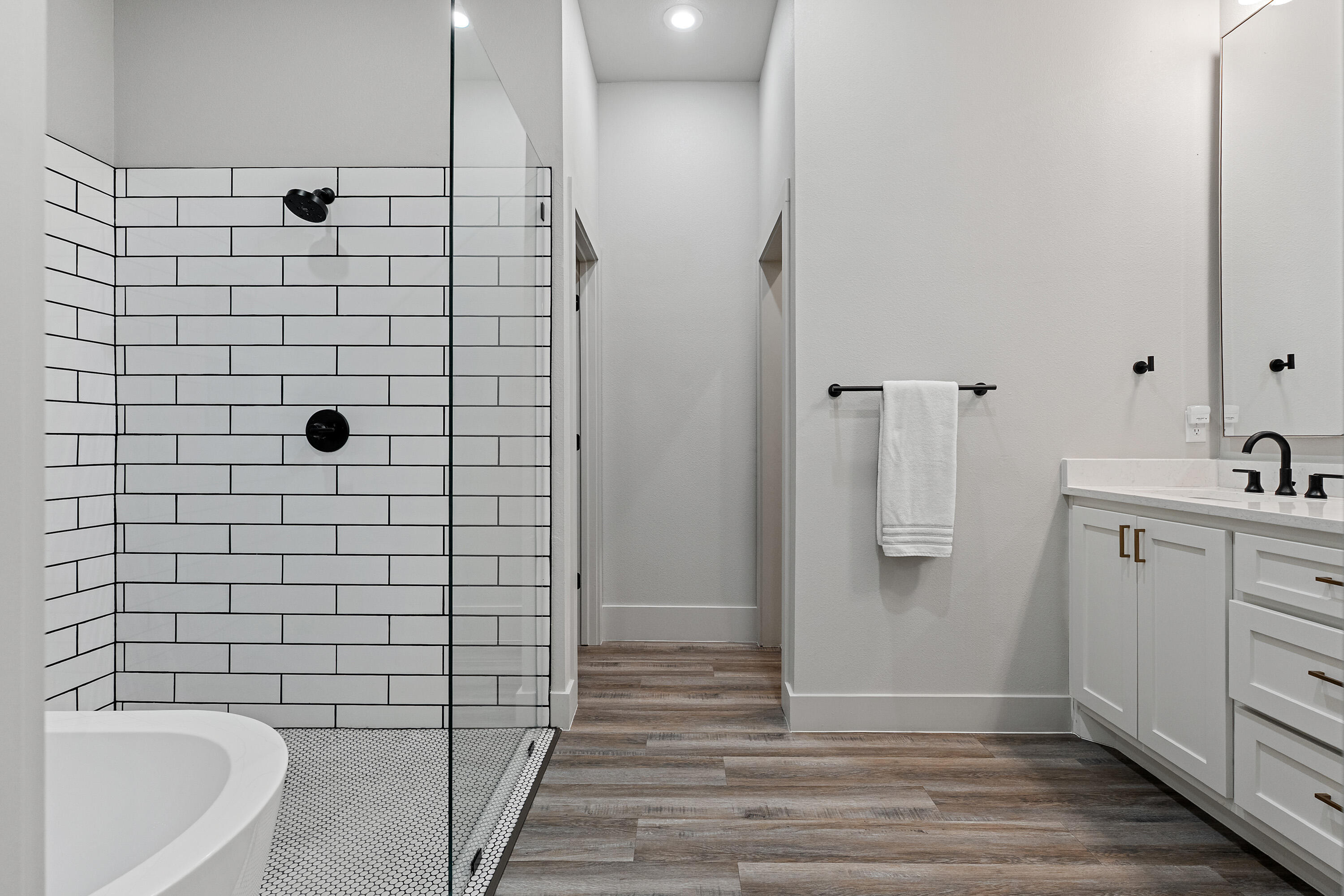 7814 55th Street Lubbock, TX 79407 - Photo 13 of 27 a bathroom with a sink and shower