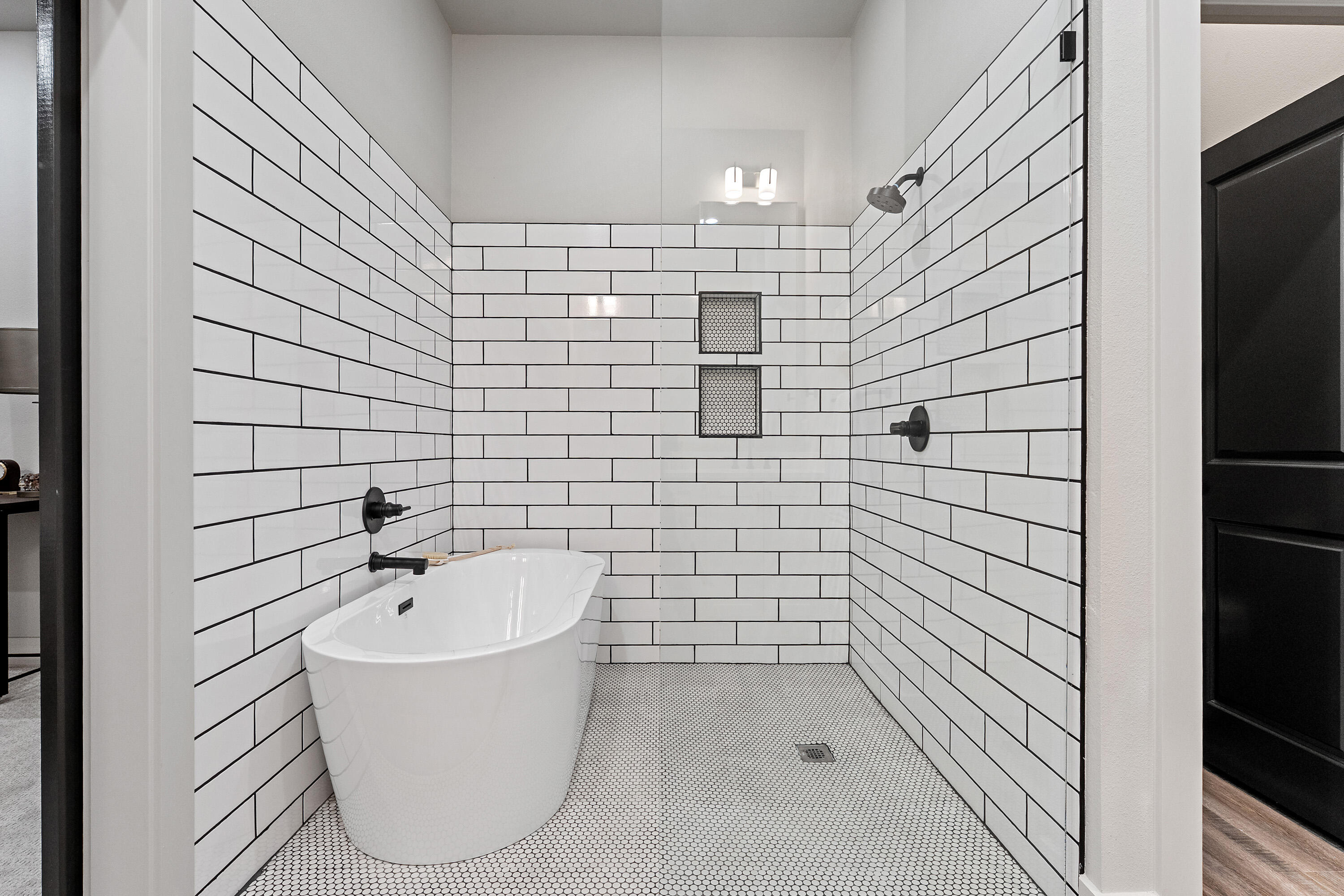 7814 55th Street Lubbock, TX 79407 - Photo 14 of 27 a bathroom with a bathtub and shower