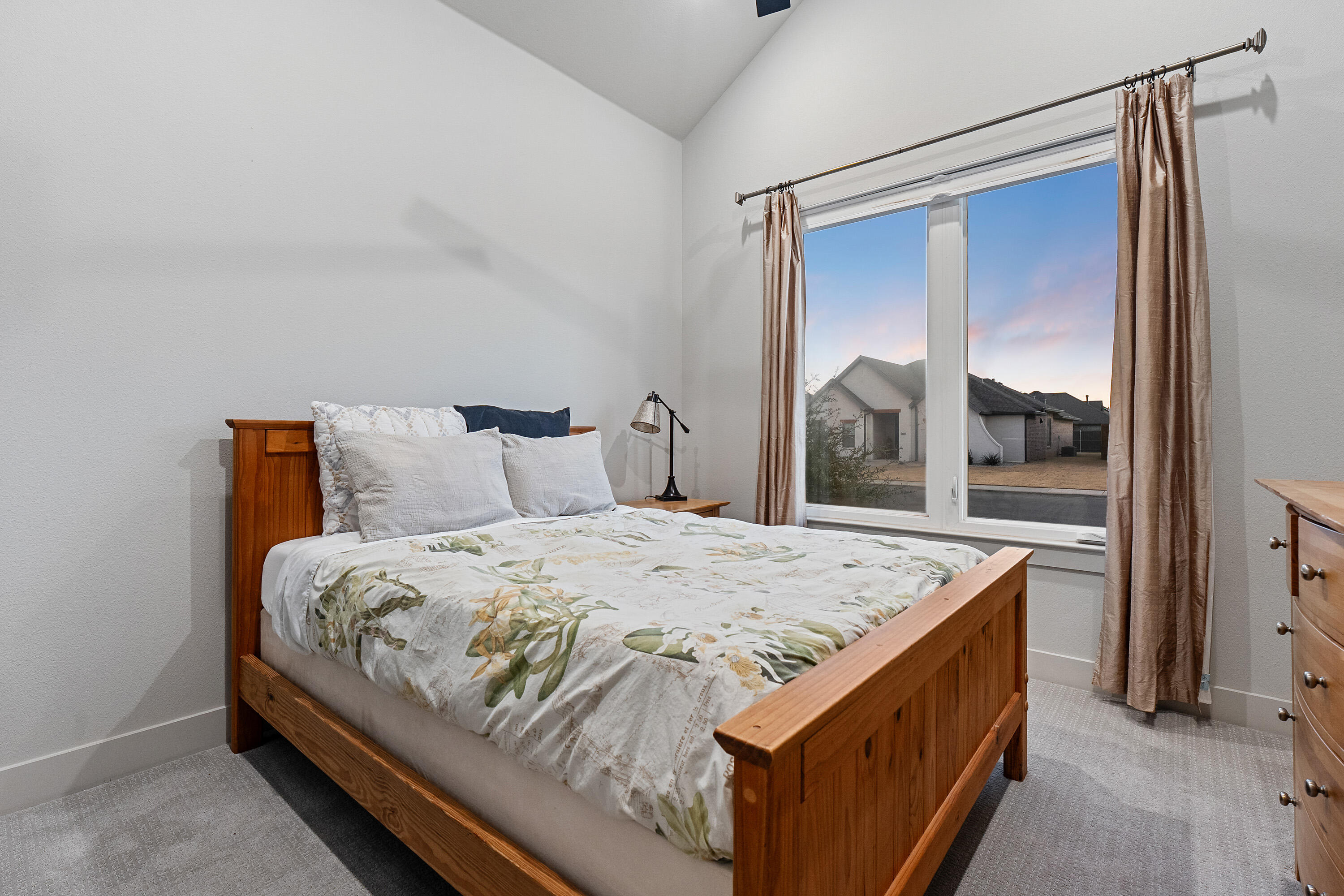 7814 55th Street Lubbock, TX 79407 - Photo 18 of 27 a bedroom with a bed and window