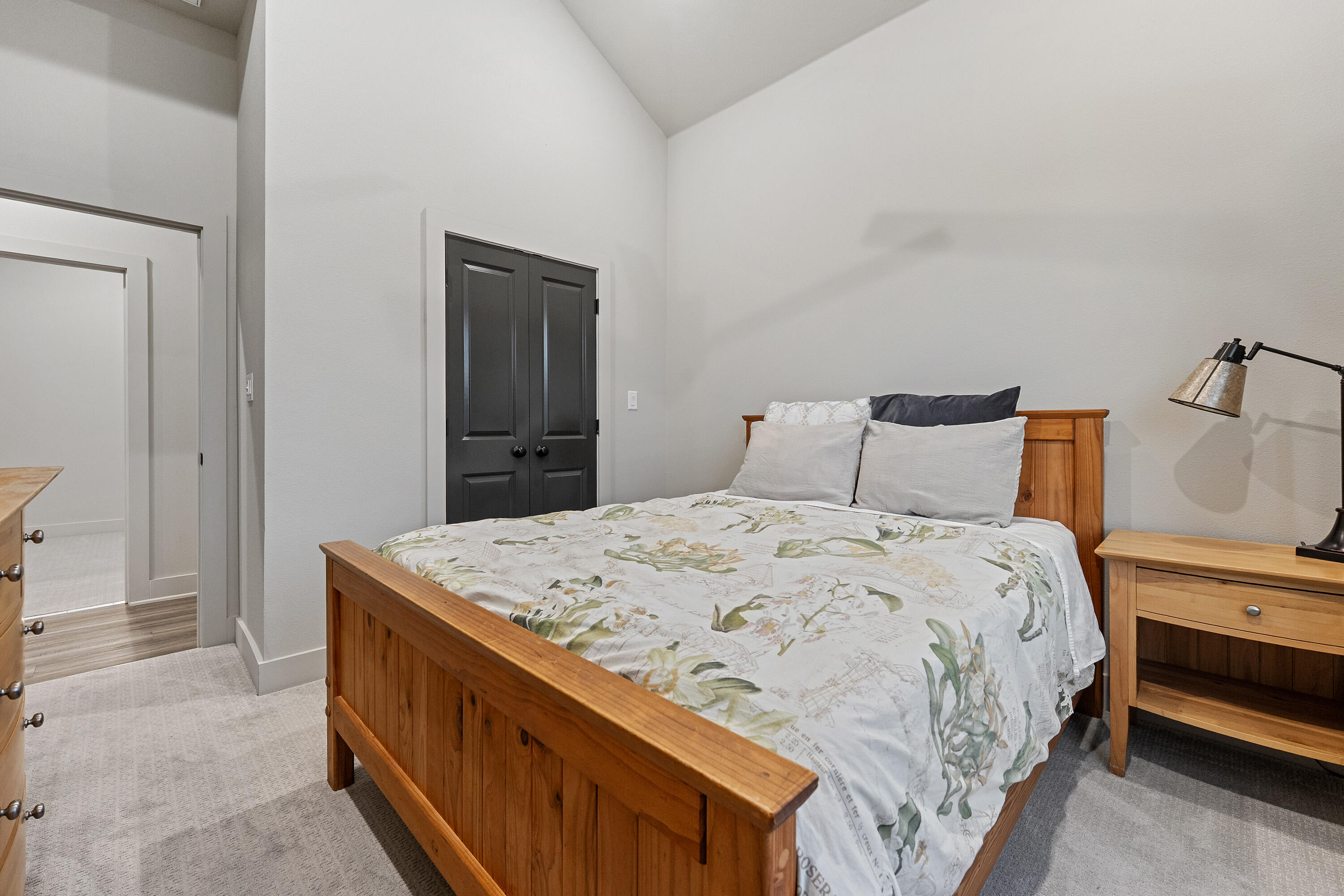 7814 55th Street Lubbock, TX 79407 - Photo 19 of 27 a bedroom with a bed and a dresser