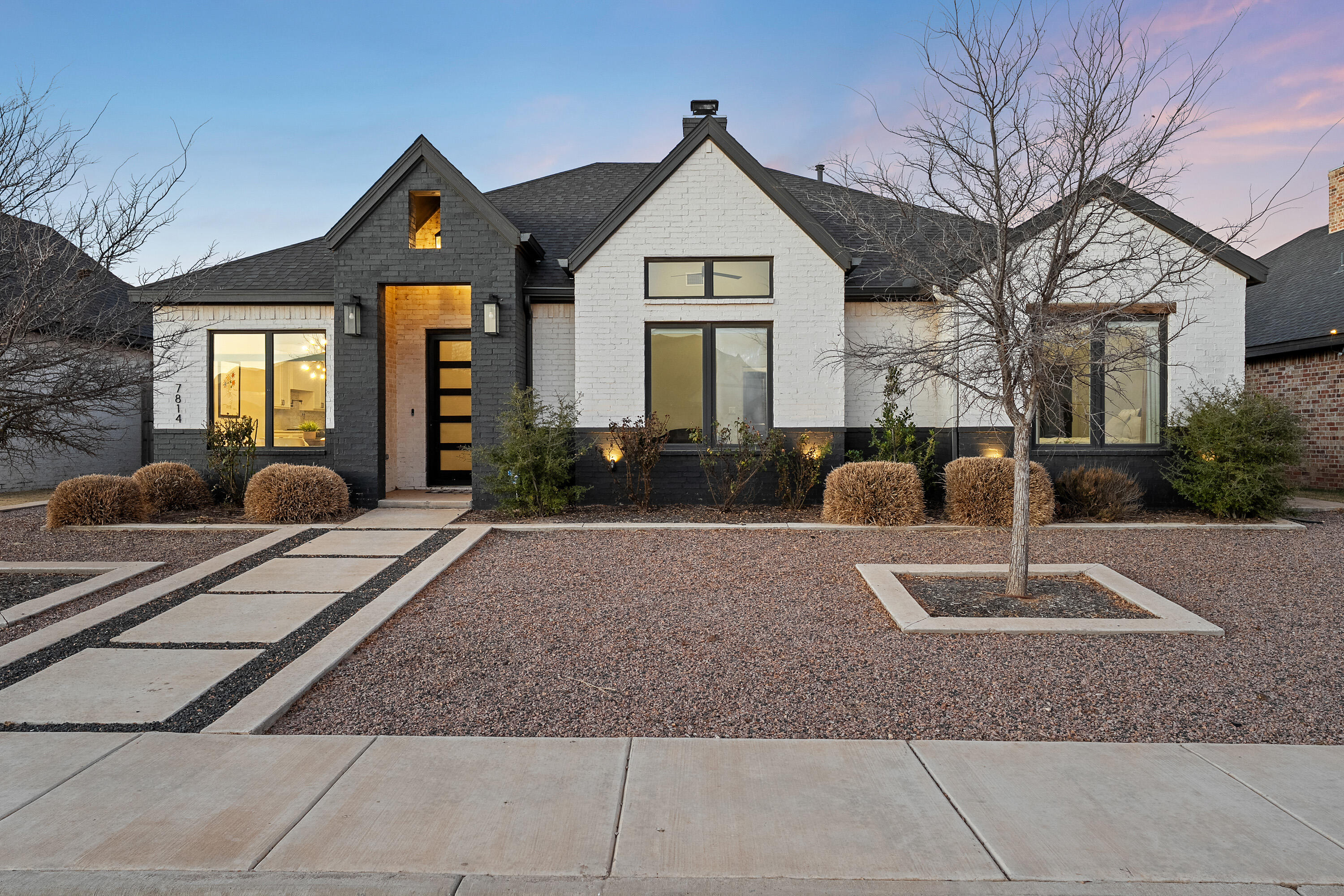 7814 55th Street Lubbock, TX 79407 - Photo 27 of 27 a front view of a house with garden