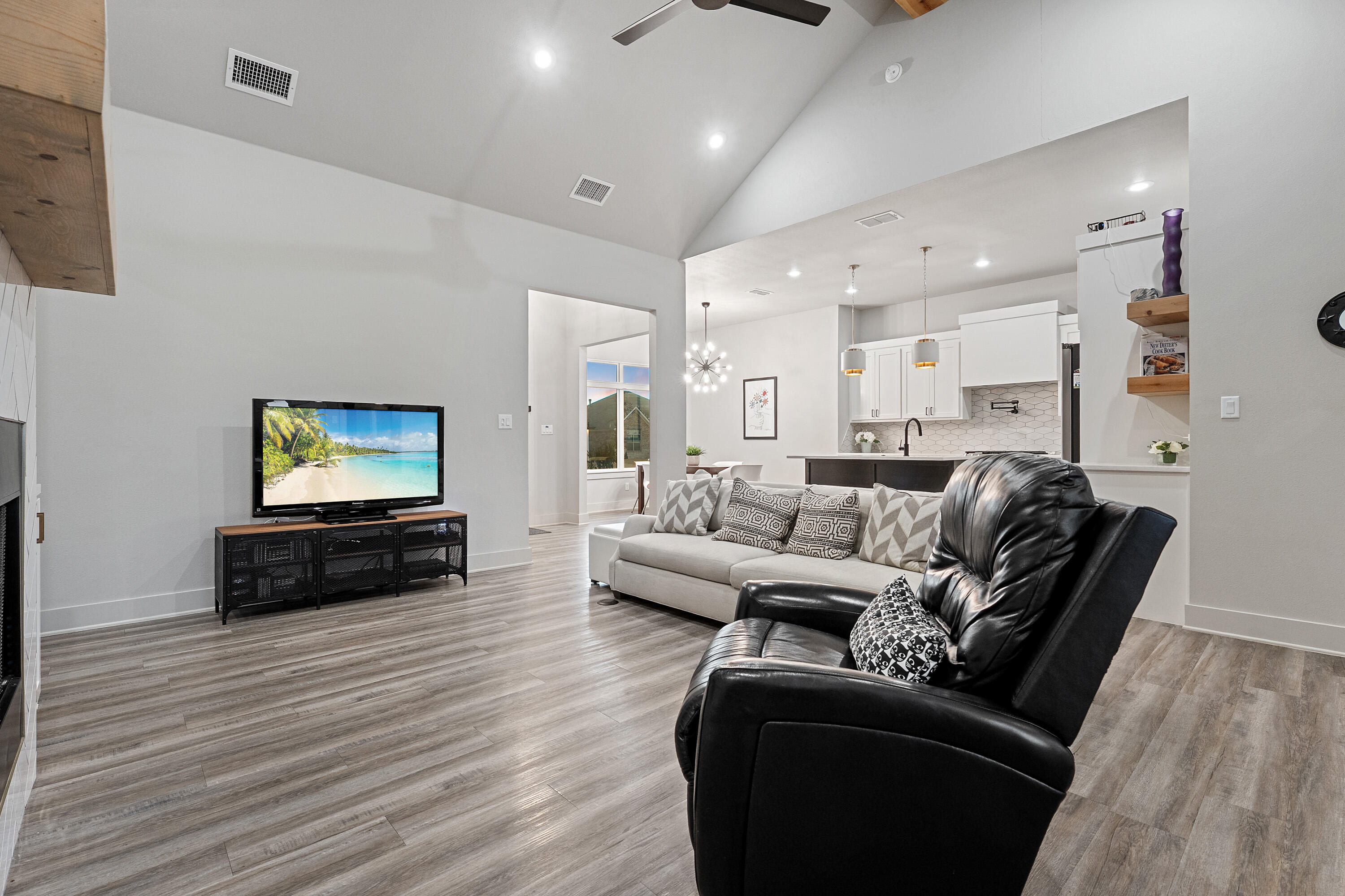 7814 55th Street Lubbock, TX 79407 - Photo 4 of 27 a living room with furniture and a flat screen tv