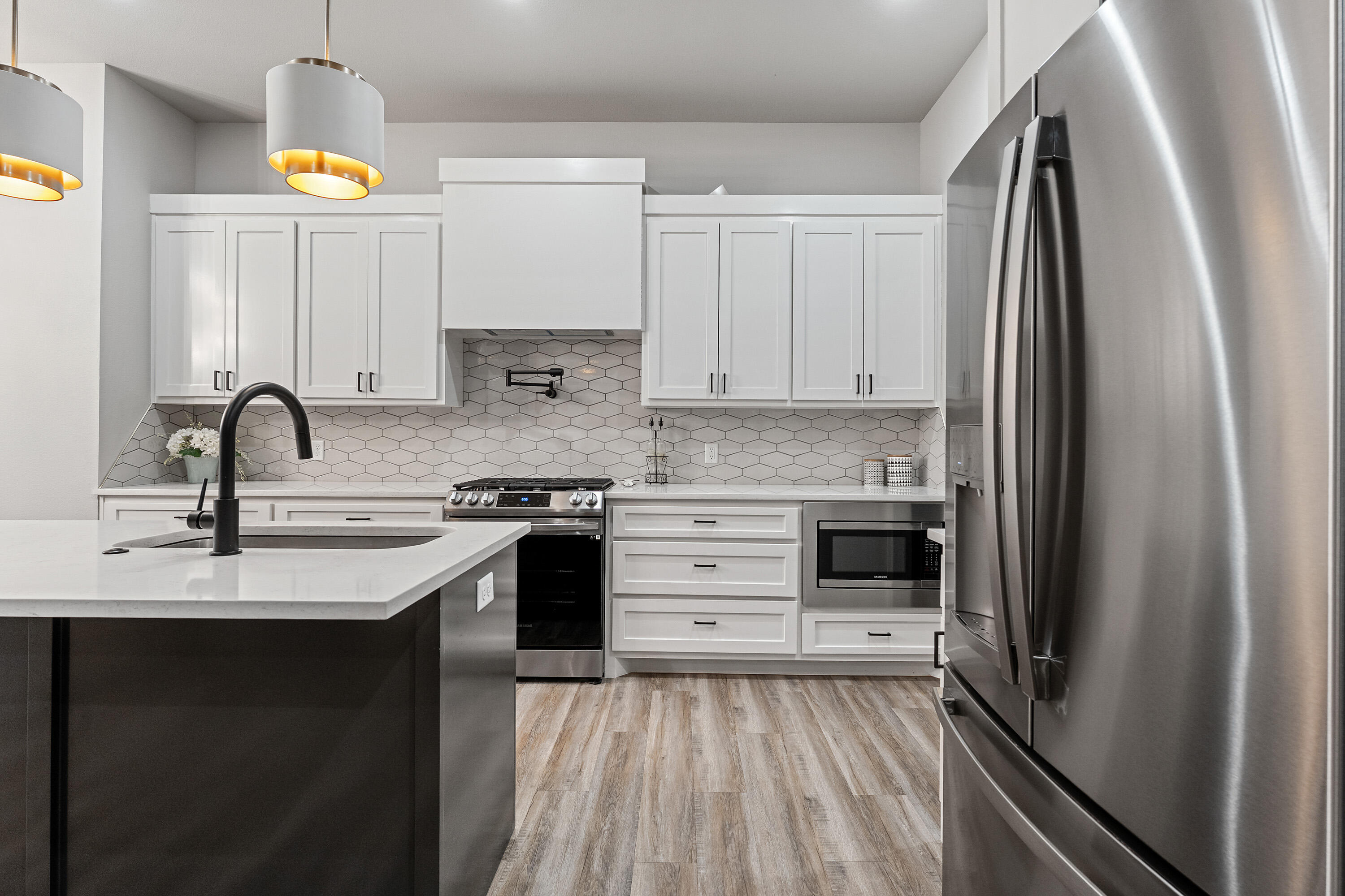 7814 55th Street Lubbock, TX 79407 - Photo 8 of 27 a kitchen with a sink appliances and cabinets