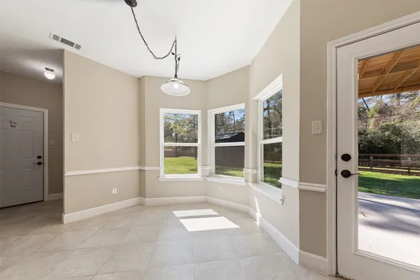 a view of a room with a large window