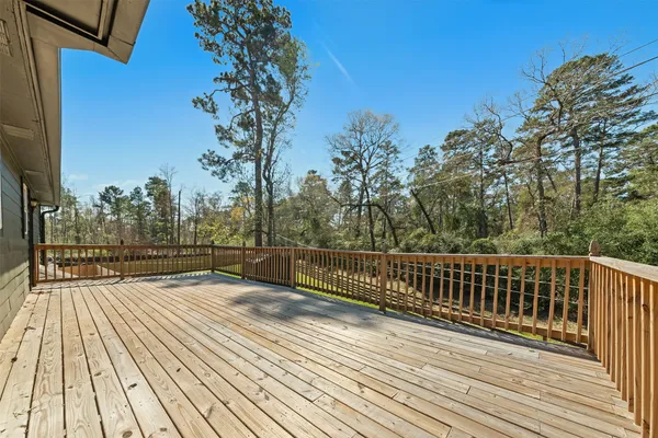 a view of balcony with wooden floor and outdoor space
