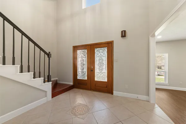 a view of an entryway with wooden floor and windows