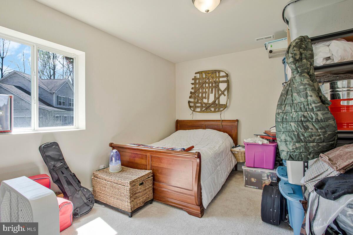 54 Simmons Ridge Road Prince Frederick, MD 20678 - Photo 44 of 55 a bedroom with bed and a window