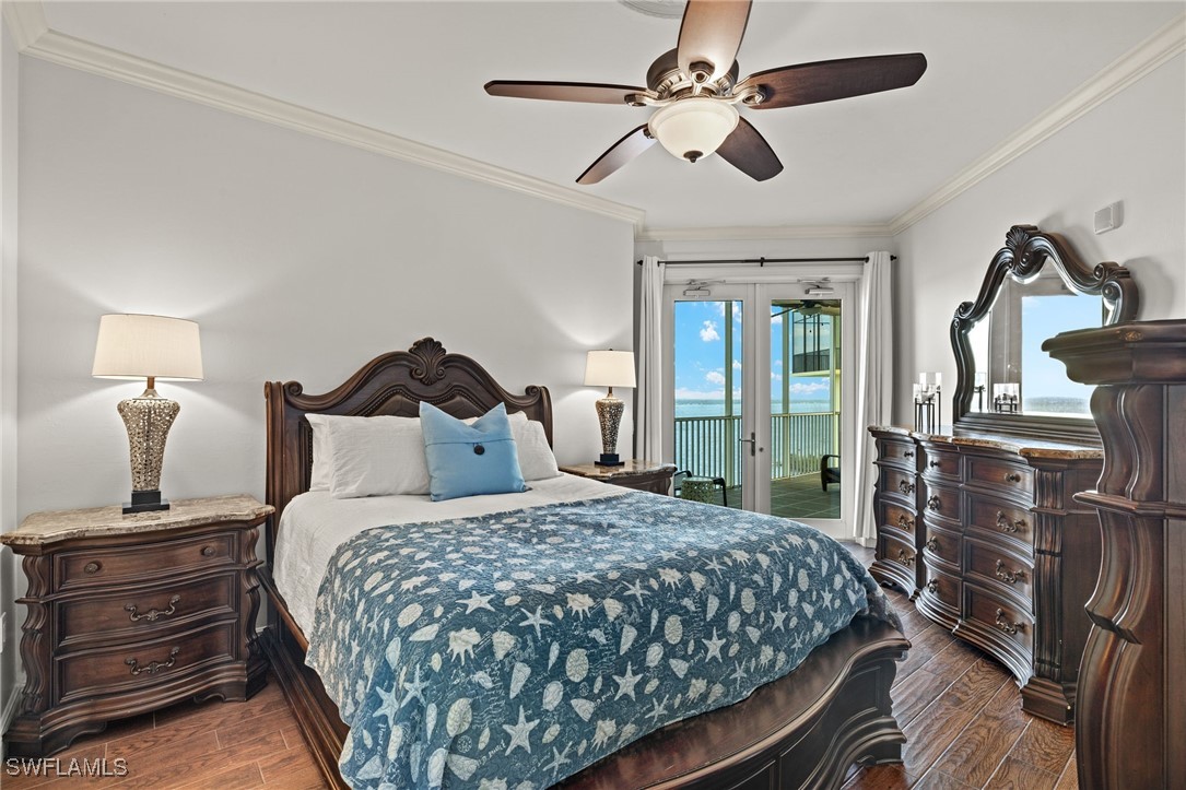 2745 First Street, Unit 1906 Fort Myers, FL 33916 - Photo 11 of 33 a bedroom with a bed and wooden floor