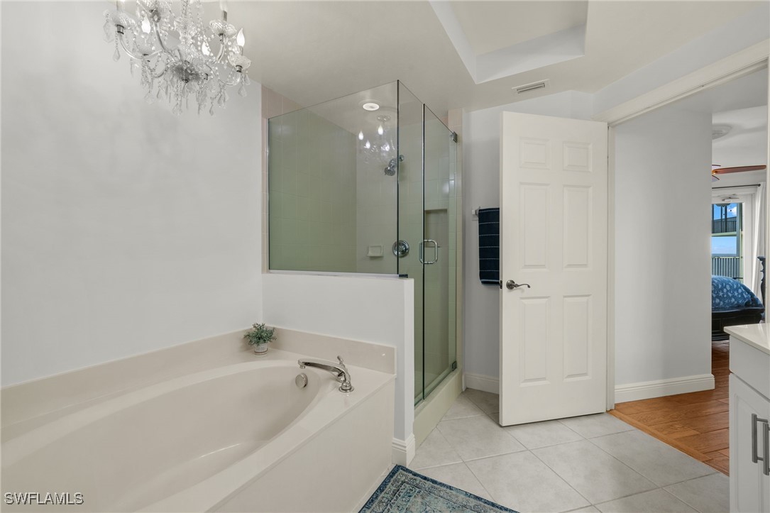2745 First Street, Unit 1906 Fort Myers, FL 33916 - Photo 15 of 33 a bathroom with a bathtub and a shower