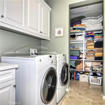 a storage room with washer and dryer