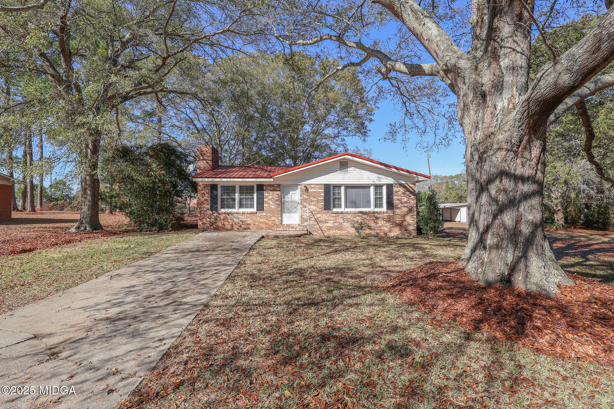 a house with trees in front of it