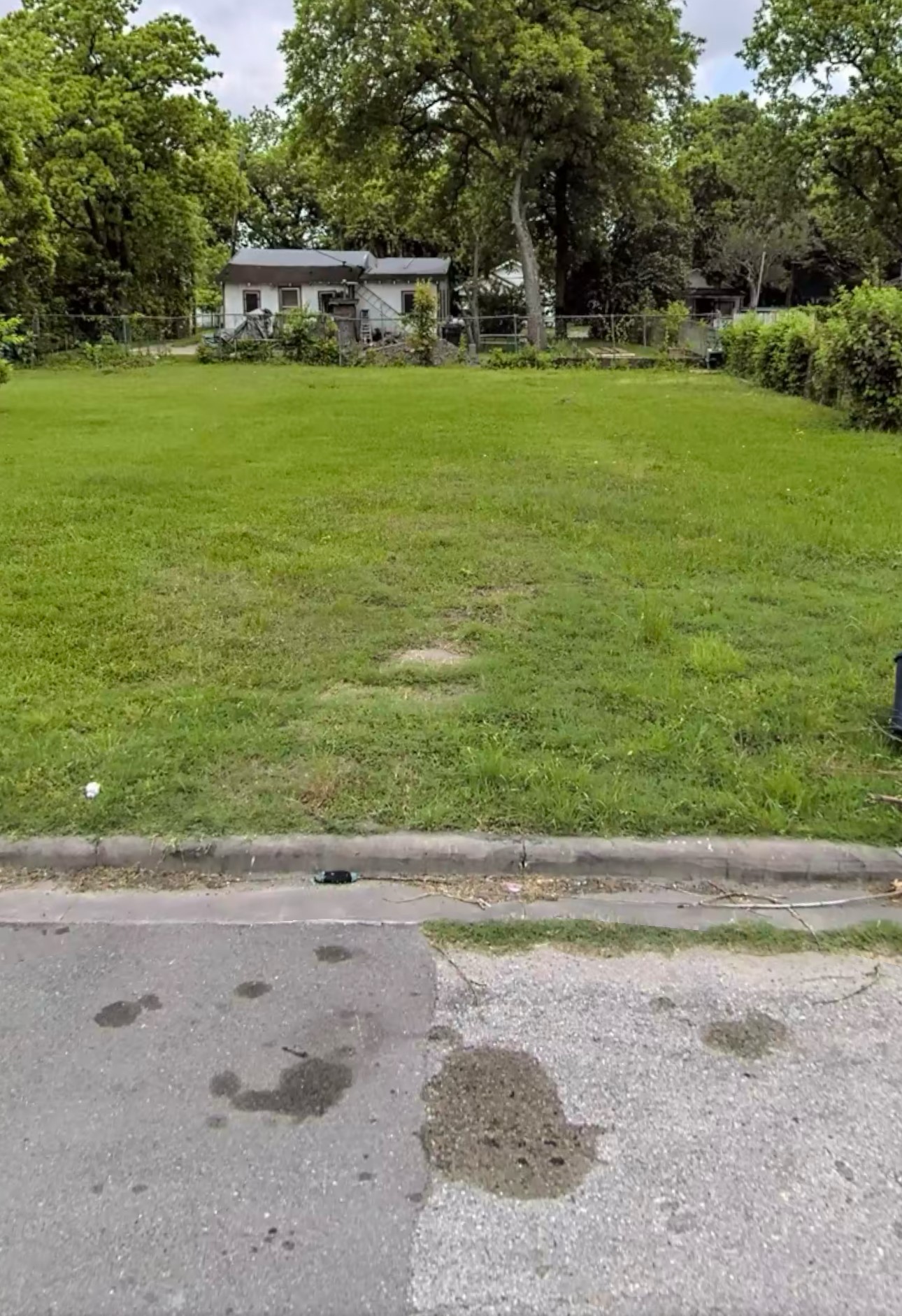 a view of a swimming pool with a yard