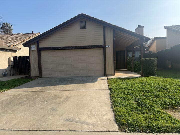 536 Capistrano Drive Modesto, CA 95354 - Photo 1 of 1 a front view of a house with a yard and garage