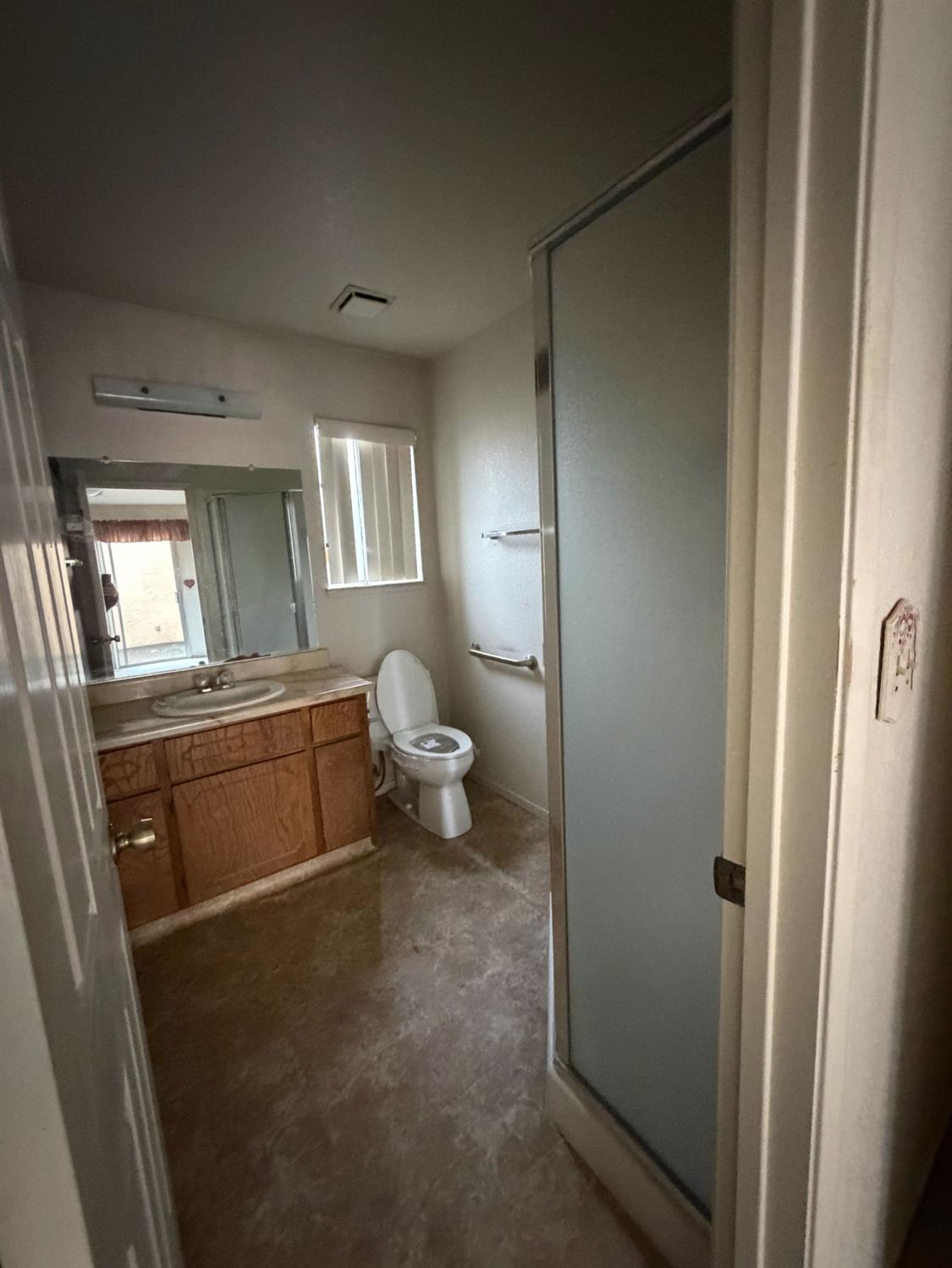 536 Capistrano Drive Modesto, CA 95354 - Photo 13 of 18 a bathroom with a toilet sink and mirror