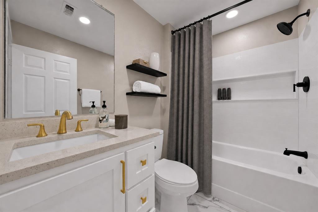 620 East 6th Street Springtown, TX 76082 - Photo 11 of 40 a bathroom with a sink toilet and shower