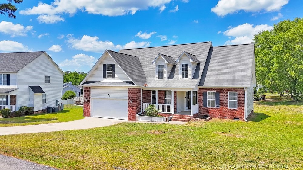 10 Pender Road Spring Lake, NC 28390 - Photo 3 of 35 a view of a house with swimming pool and a yard