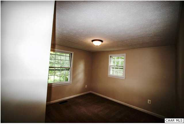 830 Ridge Street Charlottesville, VA 22902 - Photo 6 of 12 a black and white photo of a living room