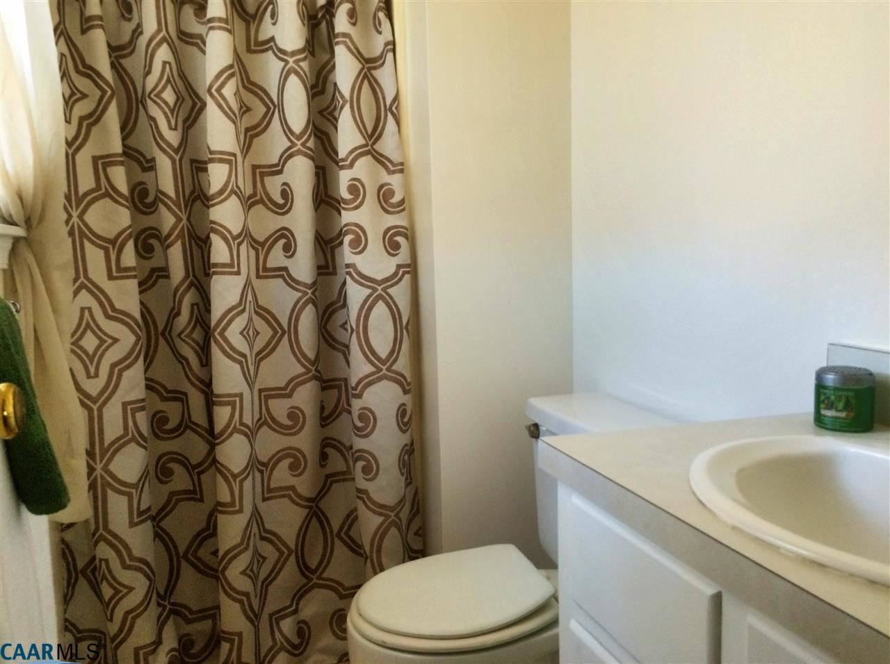 4354 Dickerson Road Charlottesville, VA 22911 - Photo 13 of 21 a bathroom with a sink a toilet and shower curtain