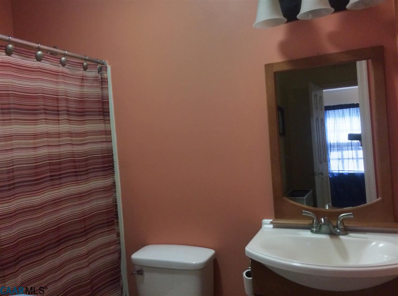 4354 Dickerson Road Charlottesville, VA 22911 - Photo 20 of 21 a bathroom with a sink a toilet and mirror