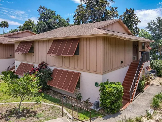 a kitchen with stainless steel appliances granite countertop a sink and a refrigerator