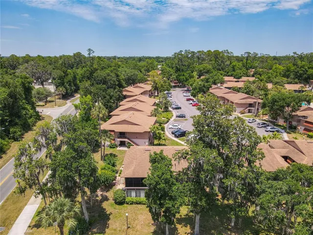 an aerial view of a house with a garden