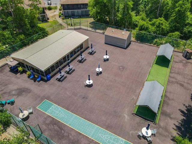 a view of swimming pool with outdoor seating and city view