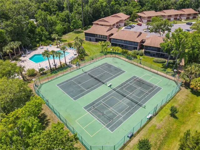 a view of a street sign on a wall next to road