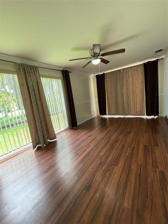 6101 Northwest 18th Street Margate, FL 33063 - Photo 15 of 22 an empty room with wooden floor and windows
