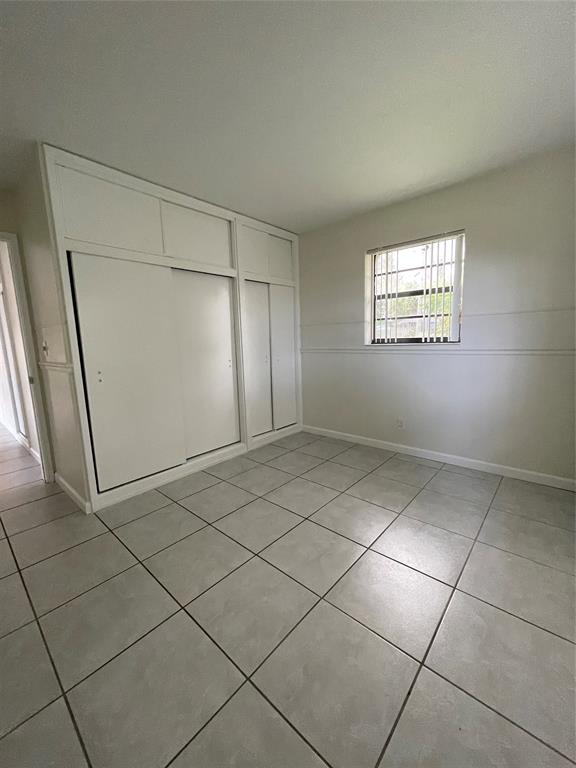 6101 Northwest 18th Street Margate, FL 33063 - Photo 20 of 22 a view of an empty room and window